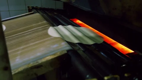 Dough enters the oven to transform into Arabic bread Video stock 121964115