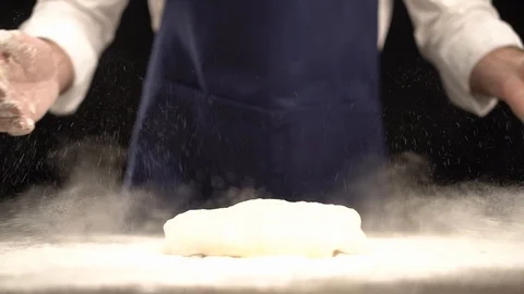 Dough falling into flour Stock Footage 123916424