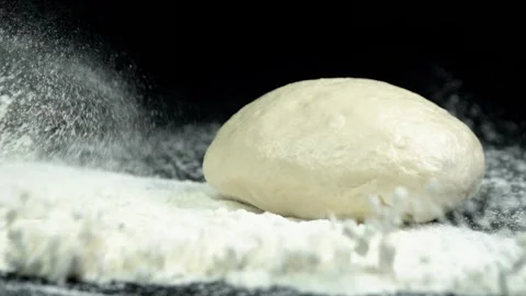 Dough Falling on Flour in Slow Motion Stock Footage 314894151