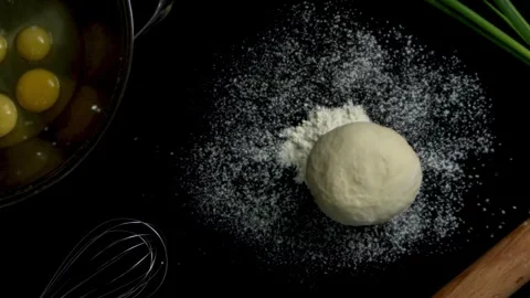 Dough Falling on Flour in Slow Motion Stock Footage 314894152