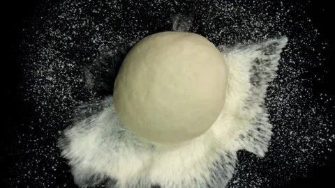 Dough Falling on Flour in Slow Motion Stock Footage 314894180