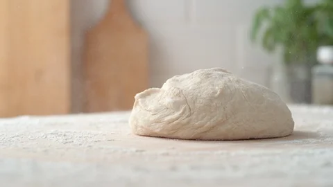 A dough falling on a table. Slow Motion. Stock Footage 128964330