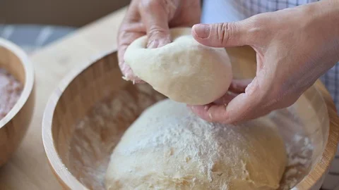 Dough in female hands Stockbeeldmateriaal 117174815