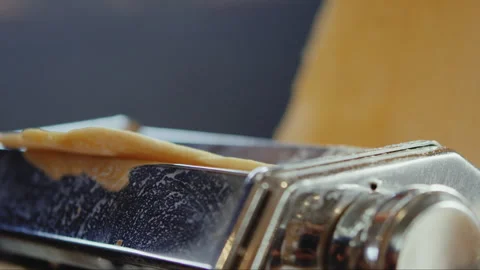 Dough going through flattening machine Stock Footage 274608836