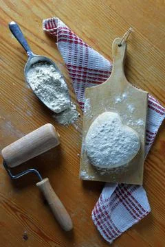 Dough in heart shape Stock Photos