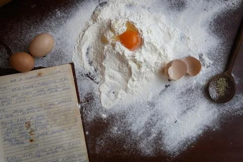 Dough ingredient on the table with old cook book Stock Photos