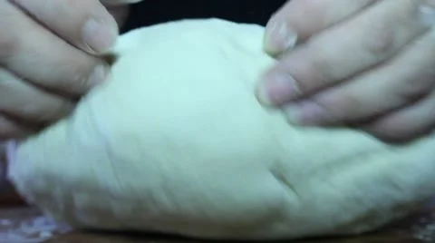 The dough is kneaded his hands Stock Footage 61453799