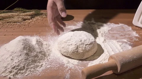 Dough kneading on a flour-poured table Video stock 76405367