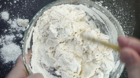 Dough kneading overhead Stock Footage 121119389