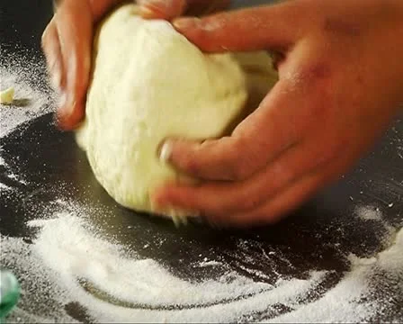 Dough on mealy kitchen table Stock Footage