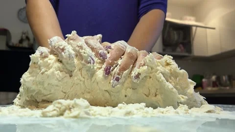 Dough is mixed with the hands in the kitchen Video stock 221201895