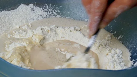 Dough Mixed With Spoon First In A Container Stock Footage 104090841