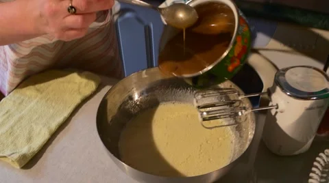 Dough Mixing Adding a Brown Mass to Gingerbread Dough Man and Woman Are Cooking Stock Footage 59120066