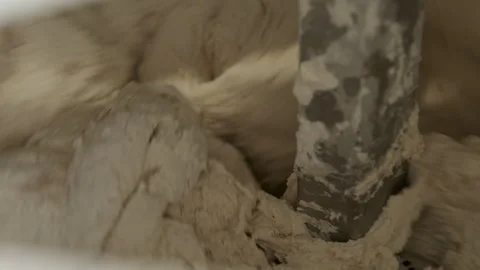 Dough mixing takes place in a kitchen during afternoon preparation for baking Stock Footage 345029902