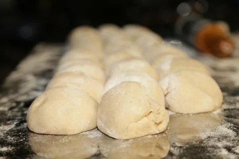 Dough Pieces in line on table with Roulette Stock Photos