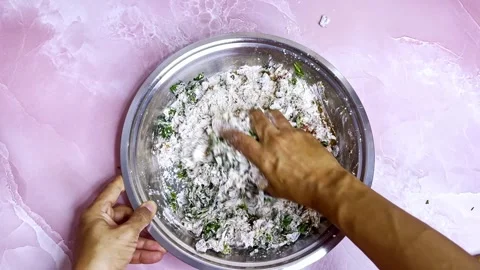 Dough plus herbs mix in shiny steel container Stock Footage 308613253