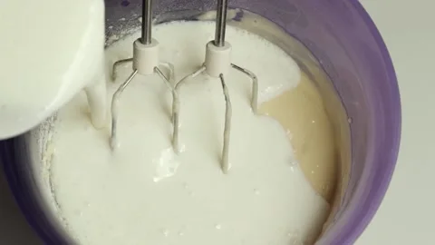 Dough preparation. Adding ingredients when kneading dough for baking. Stock Footage 201145449