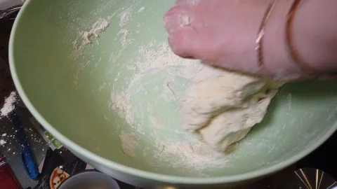 Dough preparation. baker hands kneading dough in flour in glass bowl. Close-up o Stock Footage 119033418