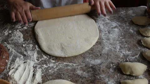 Dough preparation process knead hands ,woman cooks food. Rolling dough Stock Footage 98888369