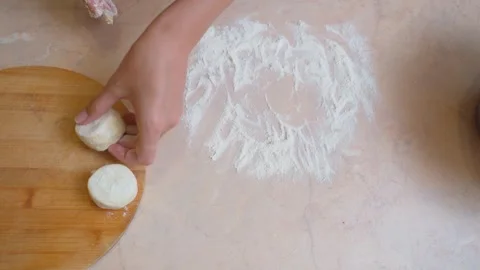 Dough preparation scene. Closeup of round dough portions ready for baking Stock Footage 329060959