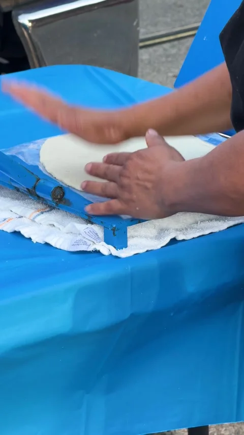 Dough Pressed for Pupusas on Blue Table Stock Footage 323876054