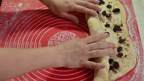 Dough rolled by hand on kitchen mat with walnut filling. Stock Footage 328347431