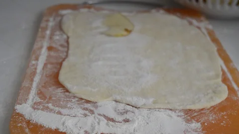 Dough rolled out for baking with apples Stock Footage 129948025