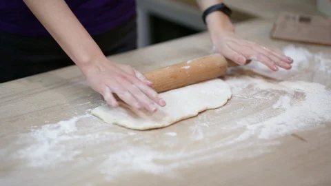 The dough is rolled out on the table Stock Footage 121788957