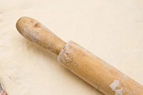 The dough with a rolling pin as a background Foto stock