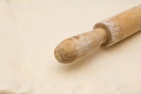 The dough with a rolling pin as a background Stock Photos