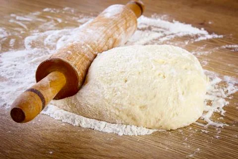 Dough with rolling pin Stock Photos