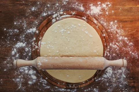 Dough with rolling pin Stock Photos