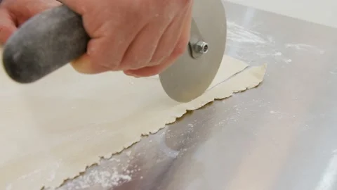 Dough sclicing with round knive Stock Footage 131823763