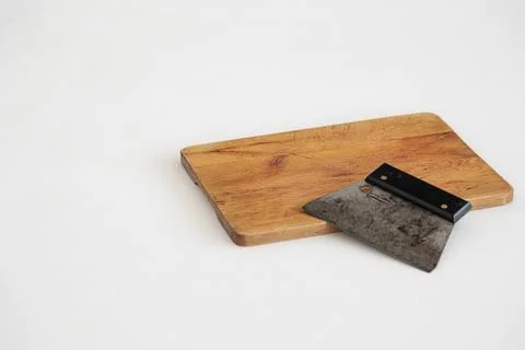 Dough scraper on bread board Stock Photos