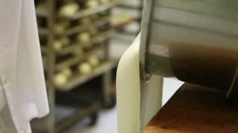 Dough spilling down onto tray pan down Stock Footage 9455602