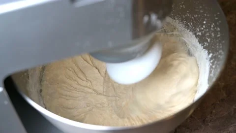 The dough is stirred in the kitchen processor Stock Footage 148533836