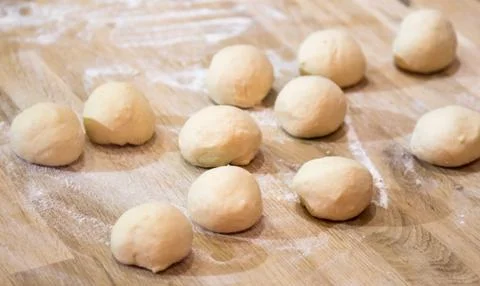 Dough on a table with flour Stock Photos