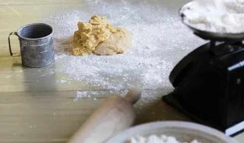 Dough on a table with a weighing scale Stock-Fotos