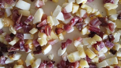 Dough Topped With Diced Hard-Boiled Eggs, salami and Cheese Видео 332563024