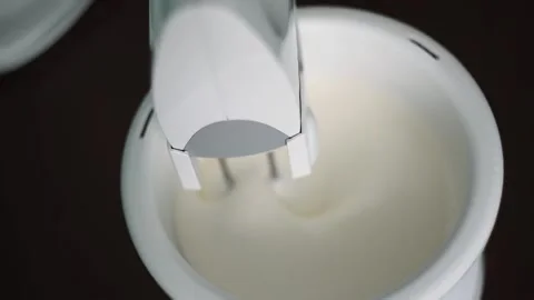 Dough is whipped by mixer Stock Footage 143782910