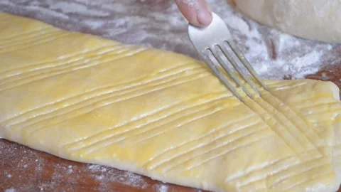 On the dough the woman makes the patterns Stock Footage 96033490