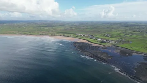 Doughmore Bay, Doonbeg in County Clare, Ireland. Aerial forward descending Stock Footage 262073861