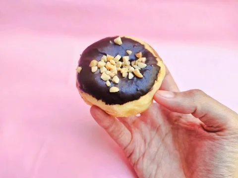 Doughnut with Chocolate and Nuts Stock Photos