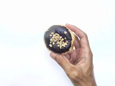 Doughnut with Chocolate and Nuts Stock Photos