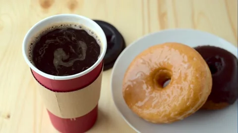 Doughnut with coffee in paper cup 스톡 동영상 143127782
