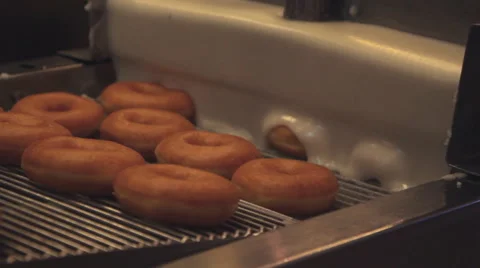 Doughnut on doughnut machine Video stock 59807576