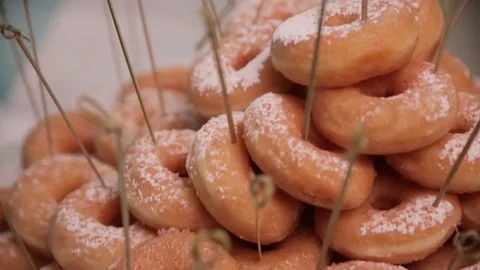 Doughnut in the form of as a gift close-up top view Stock-Footage 72484672