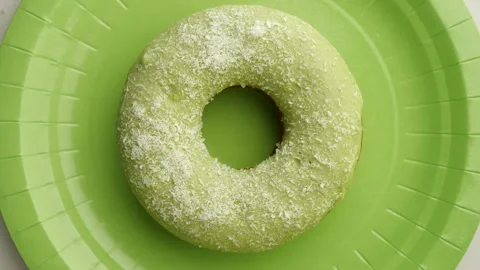 Doughnut glazed close-up. Seamless looping. Stock Footage 98100281