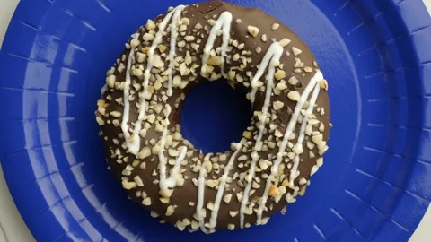 Doughnut glazed close-up. Seamless looping. Stock Footage 98420649