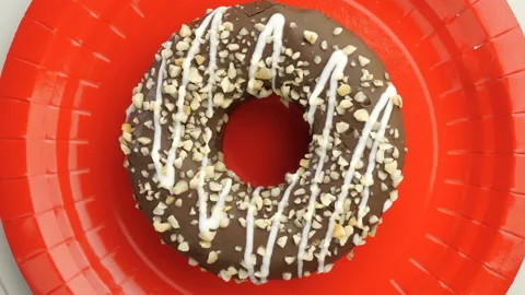 Doughnut glazed close-up. Seamless looping. Stock Footage 99487633